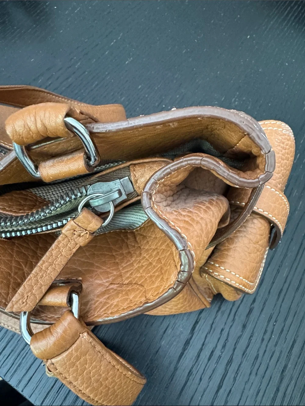Dooney & Bourke tan pebbled leather side pockets belted satchel bag.
